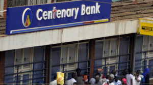 People queueing to use an ATM outside a bank