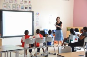 A teacher and pupils in a classroom