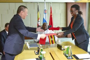 Uganda National Oil Company chief executive, Josephine Wapakabulo with Cnooc officials in Beijing, China