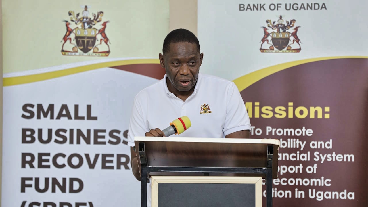 A male official speaking at a town hall forum