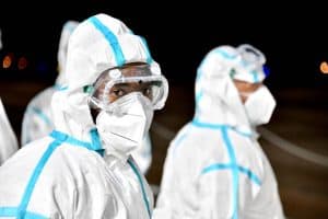 Two masked health workers