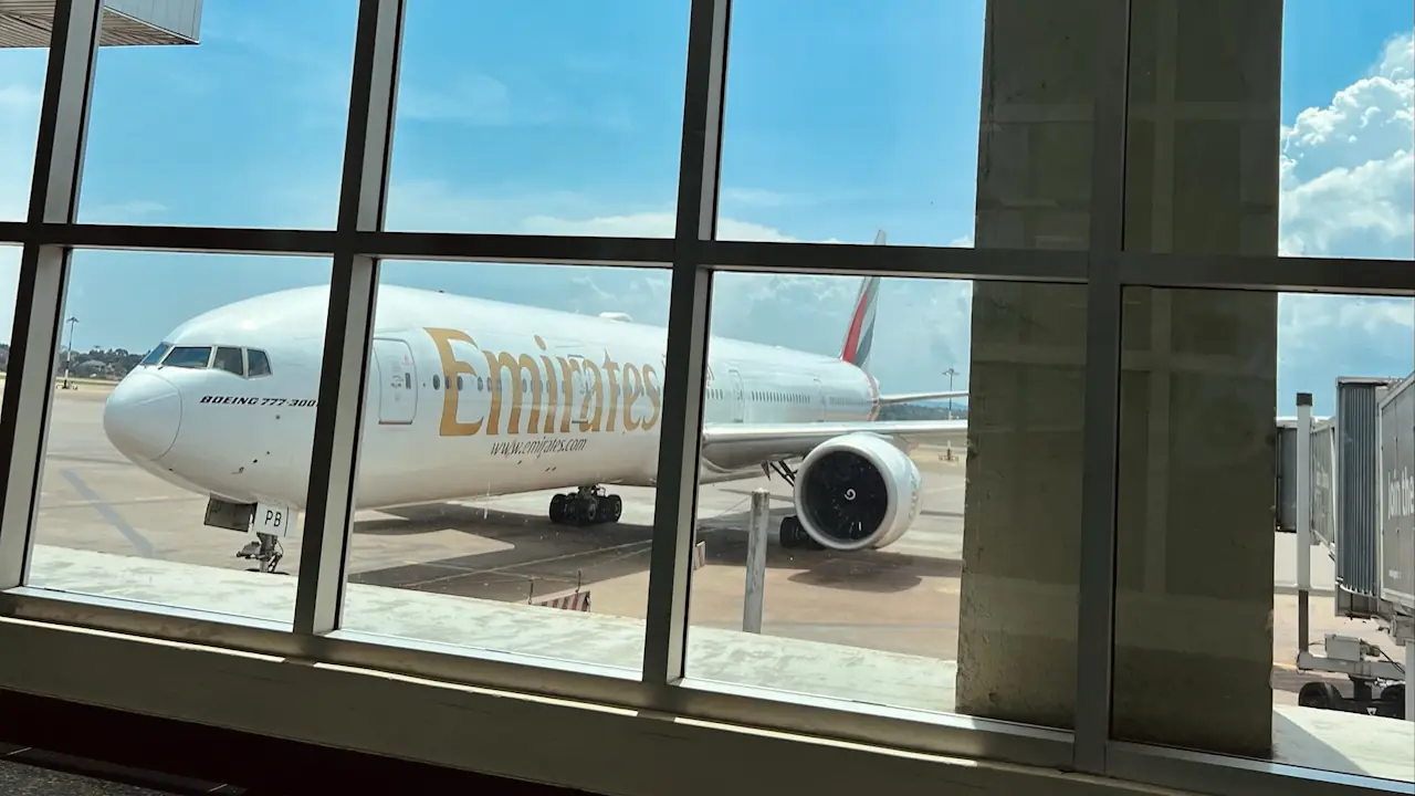A wide body jet airliner on the tarmac at an airport.