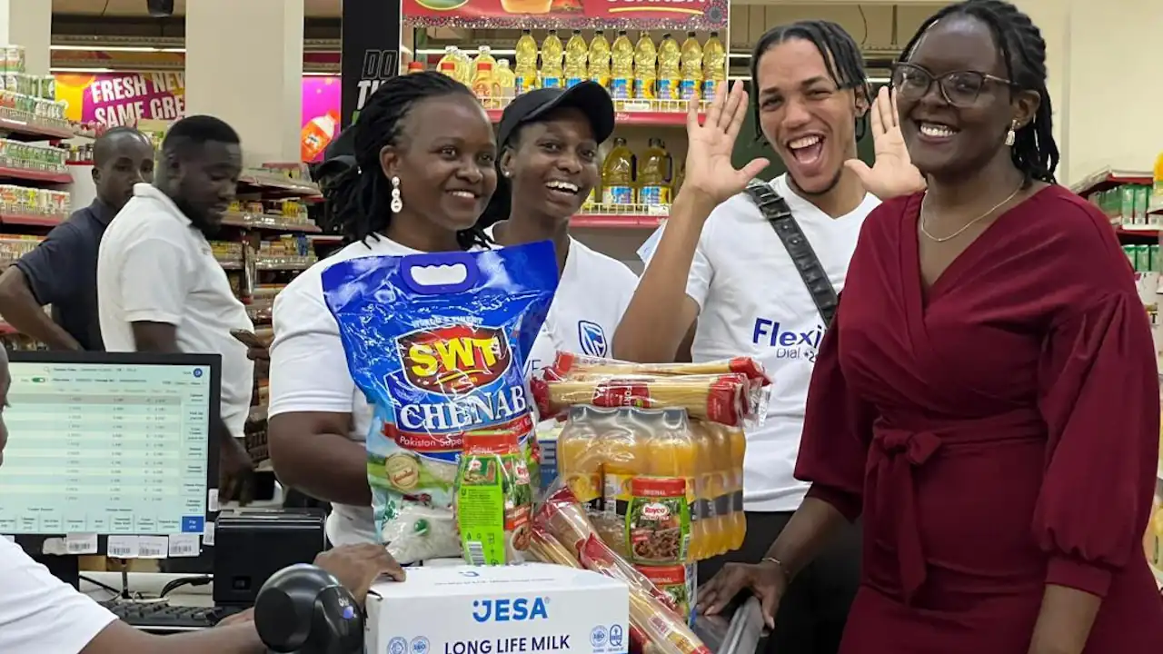 Flexipay trolley dash winner kyomuhendo leticia ejoying her moment as she checked out of the supermarket