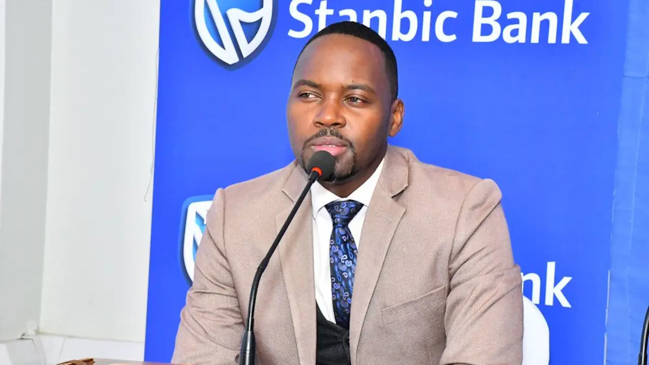 Kenneth Agutamba, Stanbic Bank Uganda's country manager for reputation and corporate communication, speaks at an official event.