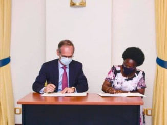 Uganda's energy minister, Mary Goretti Kituttu and Total's Nicolas Terraz signing the oil pipeline host government agreement