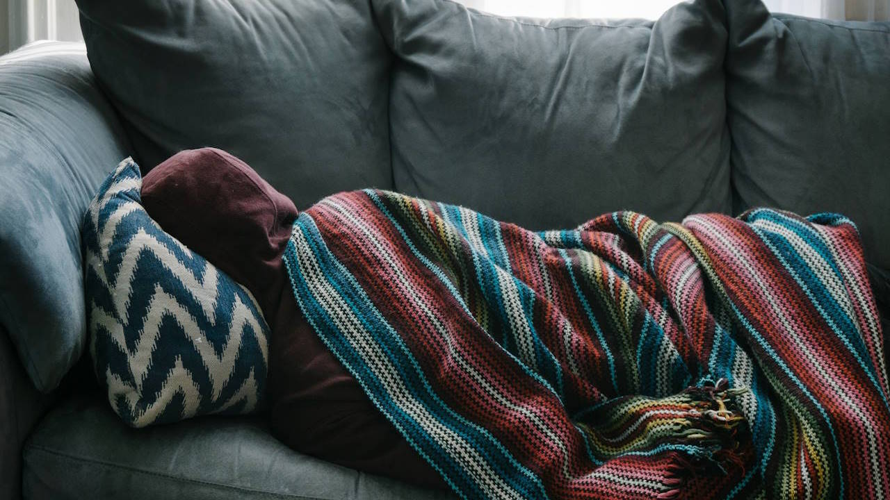 Person sleeping on a couch