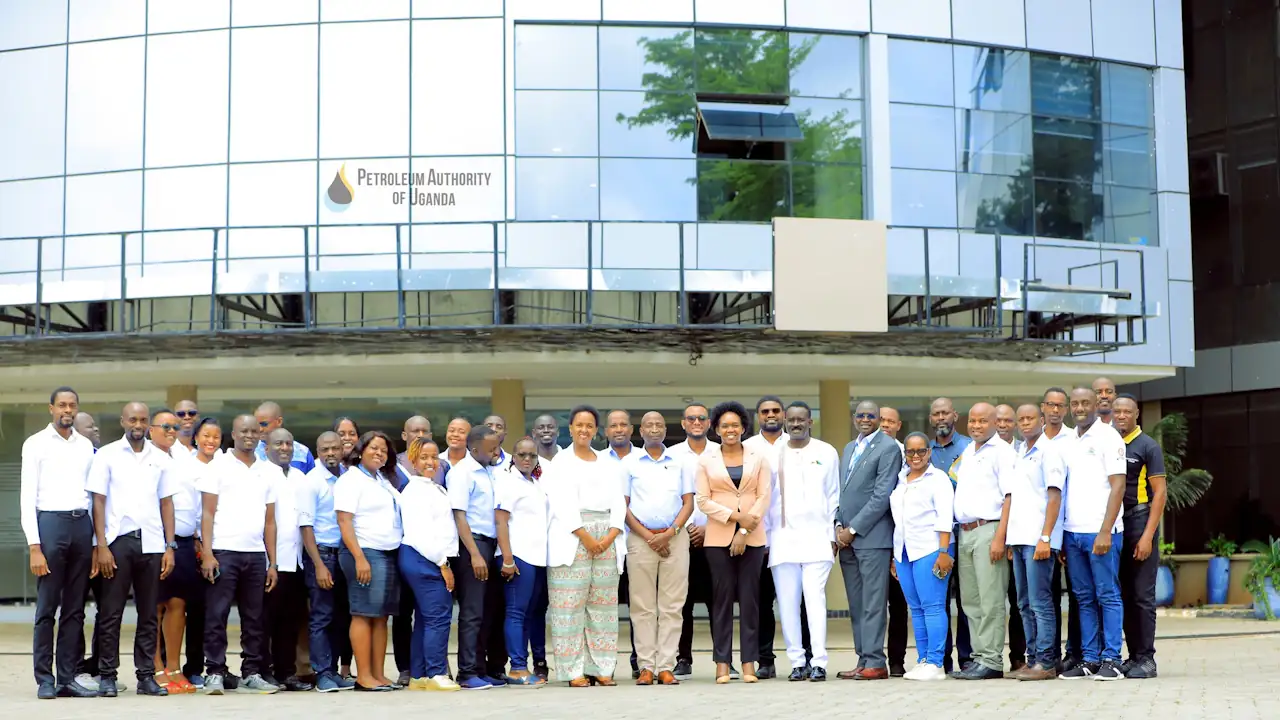 A group of people infront of the Petroleum House, the HQ of the Petroleum Authority of Uganda