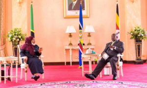 Presidents Suluhu Hassan and Yoweri Museveni, seated