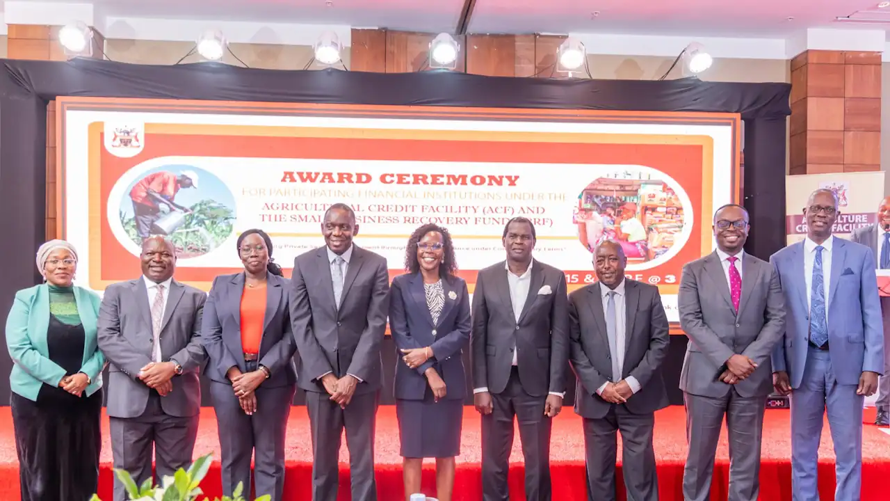 Financial sector officials stand for a group picture at an awards ceremony