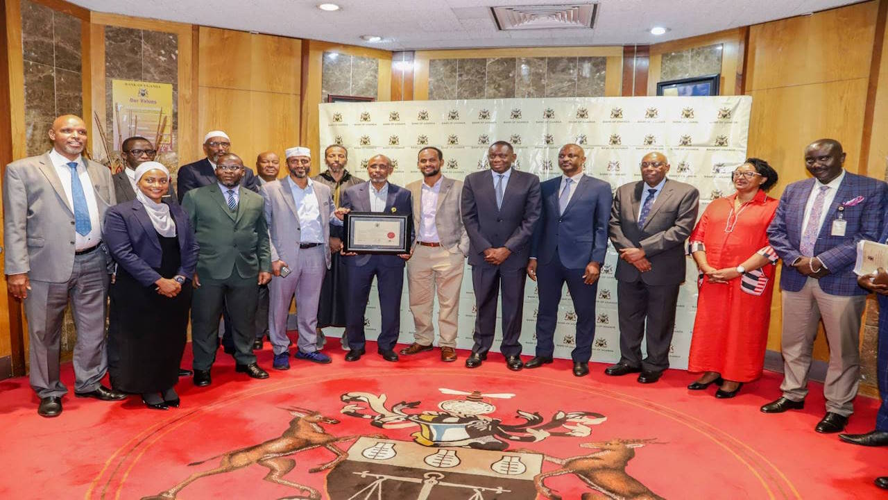 A group photo of Salaam Bank and Bank of Uganda officials in the Central Bank's boardroom