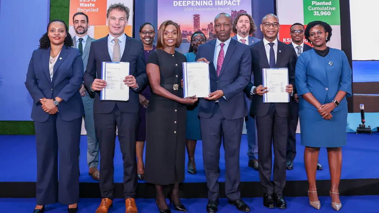 Staff from Stanbic Bank posing for a photo with other stakeholders.