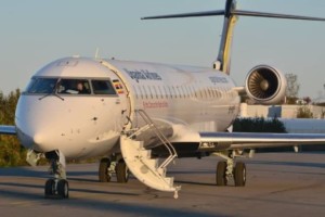 A passenger airplane packed at an airport