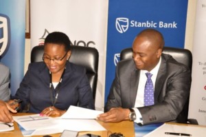 Uganda National Oil Company's chief executive officer, Proscovia Nabbanja (left) and Stanbic's chief executive, Patrick Mweheire in Kampala