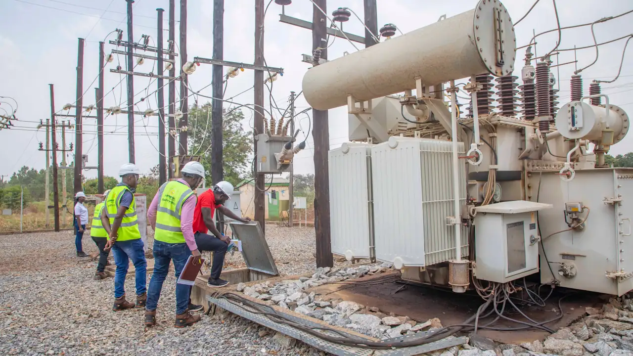 Umeme Limited employees and officials from the Electricity Regulatory Authority of Uganda inspect a power station