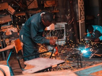 Men operating welding machinery